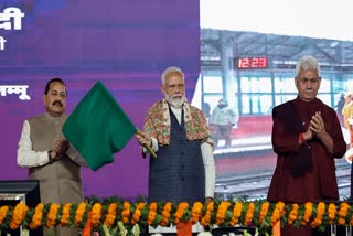 Prime Minister Narendra Modi flags off the first electric train in the valley and the train service between Sangaldan and Baramulla stations, as Union Minister of State (Ind. Charge) Science and Technology Jitendra Singh and Jammu and Kashmir Lieutenant Governor Manoj Sinha look on, in Jammu