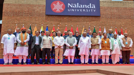 Prime Minister Narendra Modi in a group photo with Bihar CM Nitish Kumar, EAM Dr S Jaishankar and others during the inauguration of the new campus of Nalanda University in Bihar on Wednesday