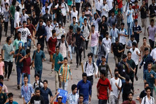 Student protesters run after being chased by security forces during the quota protest in Bangladesh