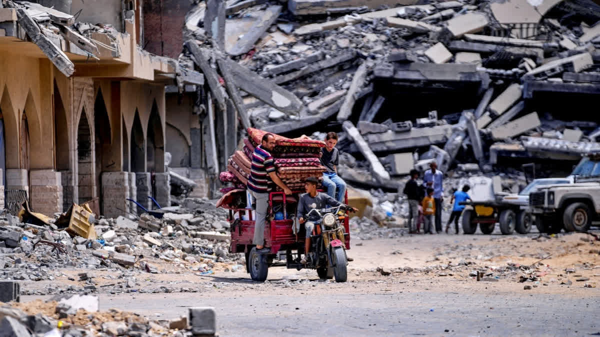 Palestinians displaced by the Israeli air and ground offensive on the Gaza Strip flee from Hamad City, following an evacuation order by the Israeli army to leave parts of the southern area of Khan Younis, Sunday, Aug. 11, 2024.