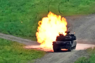 A U.S. Army's M1A2 Abrams tank from the 1st Armored Brigade Combat Team fires during a live firing drill at Rodriguez Live Fire Complex in Pocheon, South Korea, Wednesday, Aug. 14, 2024.