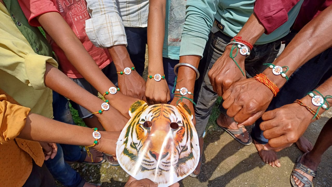 WEARING TIGER MASKS TO TIED RAKHI