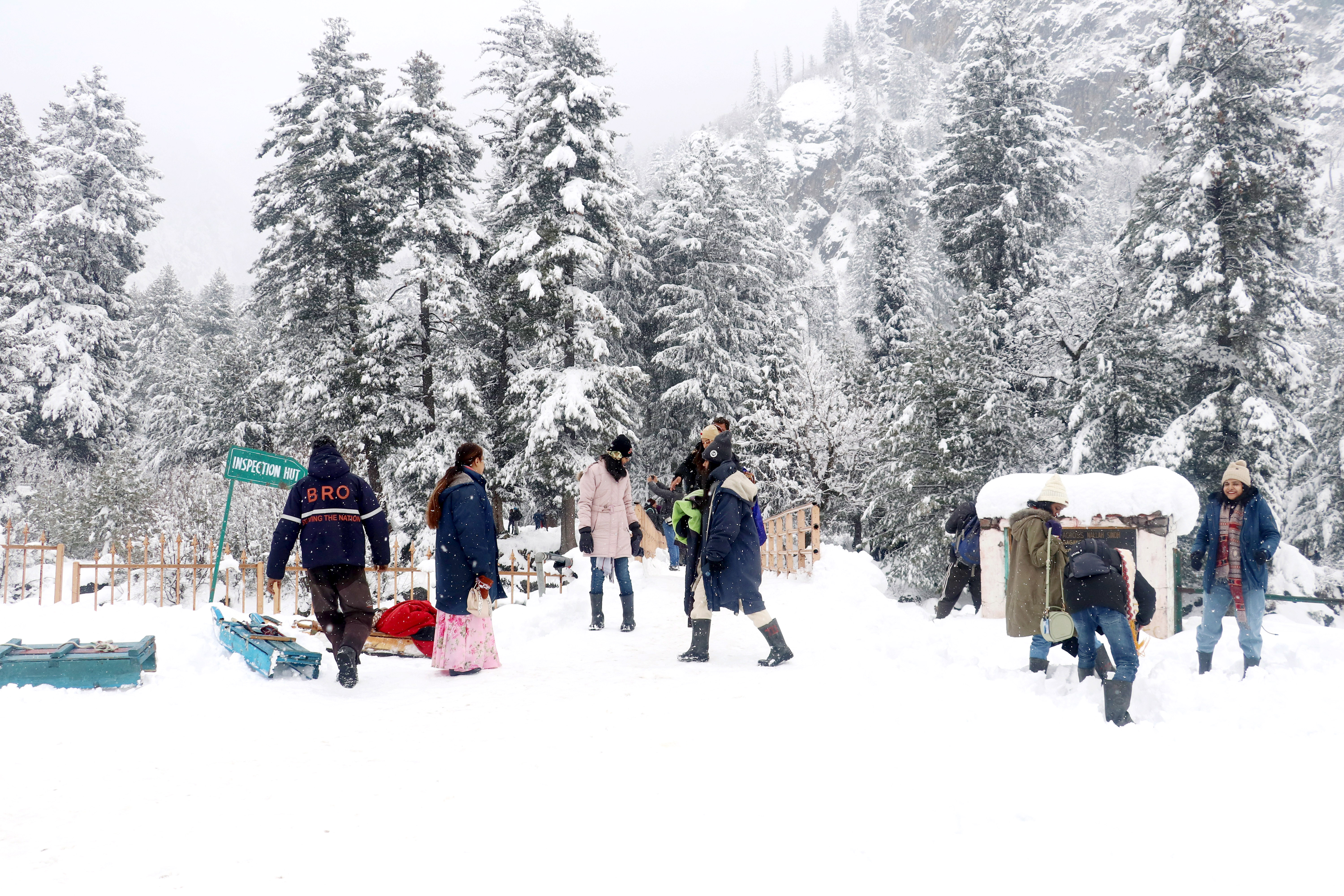 Tourists play in the snow after the upper reaches of Kashmir receives fresh snowfall, at Sonamarg, in Ganderbal