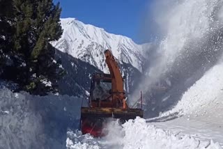 A snow clearance machine in action after fresh snowfall in Kashmir