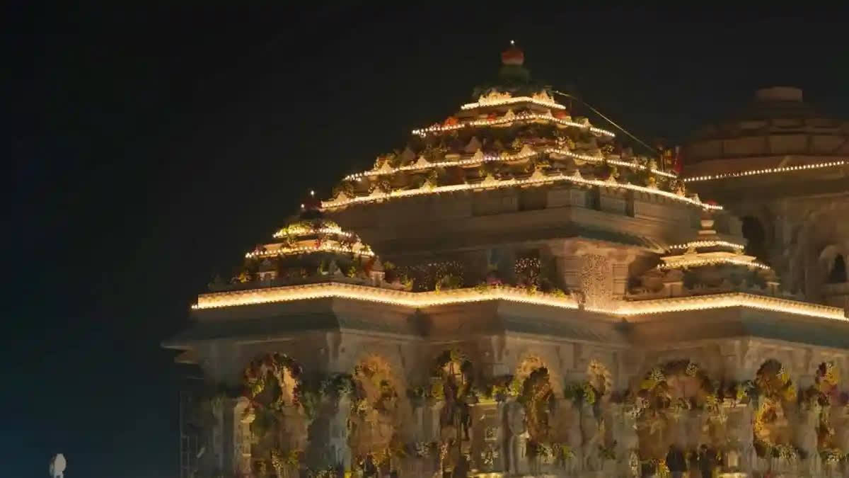 Ayodhya is reviving its religious spirit with the opening of a new PSU bank branch along Ram Path. The branch, named 'Ramjanmabhoomi', features ornate lampposts, canopies, and a banner featuring the Ram temple and the bank's name. A redeveloped road, Ramjanmabhoomi Path, leads to a hoarding featuring the Ram temple, city skyline, and Lord Ram holding his bow.