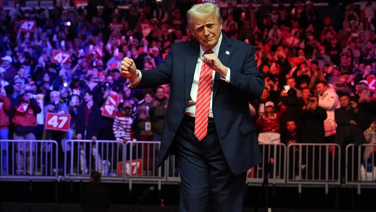 President-elect Donald Trump dances with The Village People at a rally ahead of the 60th Presidential Inauguration, Sunday, Jan. 19, 2025, in Washington.