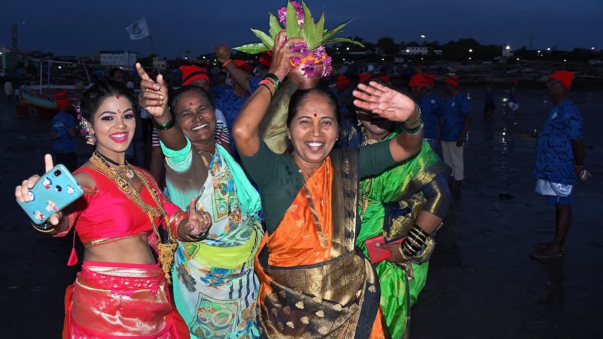 Fisherwomen all smile amid the celebration of 'Narali Purnima' on the beach, in Mumbai