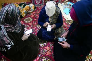 People using the internet as 4G Internet is restored across Jammu And Kashmir after 18 Months, in Srinagar