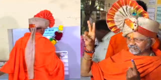 Shantigiri Maharaj, an independent candidate from Maharashtra’s Nashik put a garland on the Electronic voting machine (EVM) after casting his vote on Monday. He exercised his vote at a polling station in Trimbakeshwar.