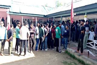 Voters standing in queue to vote in Budgam
