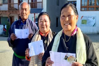 Voters pose with voter slips during the fifth phase of Lok Sabha election 2024 in Ladakh on Monday May 20, 2024