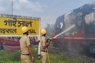 TRAIN CATCHES FIRE