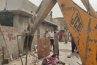 Bulldozer action on illegal property