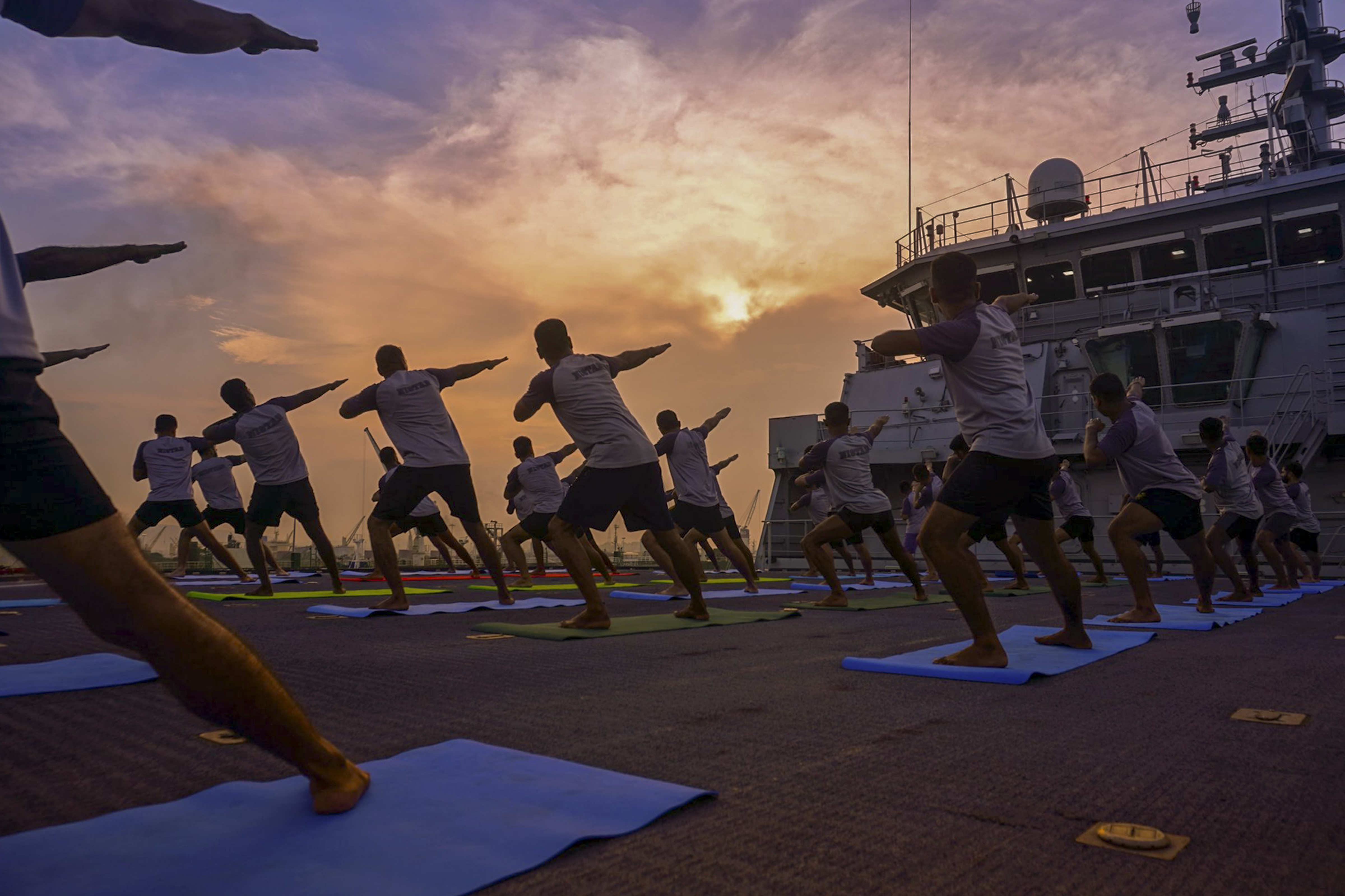 The Indian Navy personnel participate in a yoga session ahead of the International Day of Yoga.