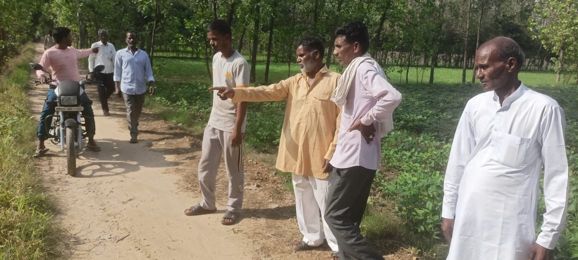 A man points to the spot where dogs mauled a boy to death in Saharanpur