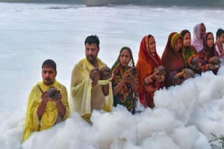 Chhath Puja in shadow of health hazards: Devotees stand in knee-deep toxic foam in Yamuna for ritual