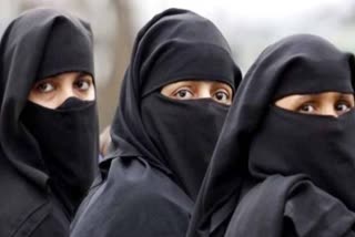 Can you vote while wearing a burqa