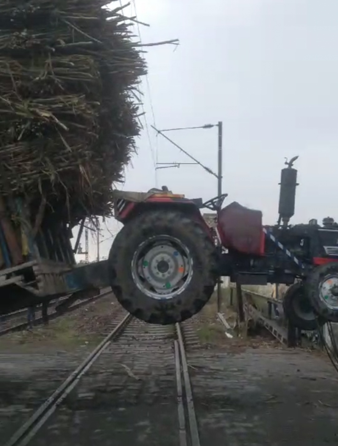 tractor trolley stuck at railway track