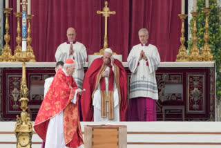 FILE - Pope Francis, touch is forehead as Cardinal Giovanni Battista Re spreads incense on the coffin of late Pope Emeritus Benedict XVI during a funeral mass in St. Peter's Square at the Vatican, Thursday, Jan. 5, 2023.