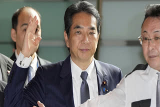 Japan's Agriculture Minister Taku Eto, center, arrives at the prime minister's office in Tokyo Wednesday, May 21, 2025.