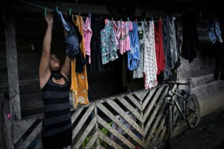 Maricel Sanchez finishes doing the laundry at her home in the small town of Limon, in Cocle province, Panama, on May 14, 2025.
