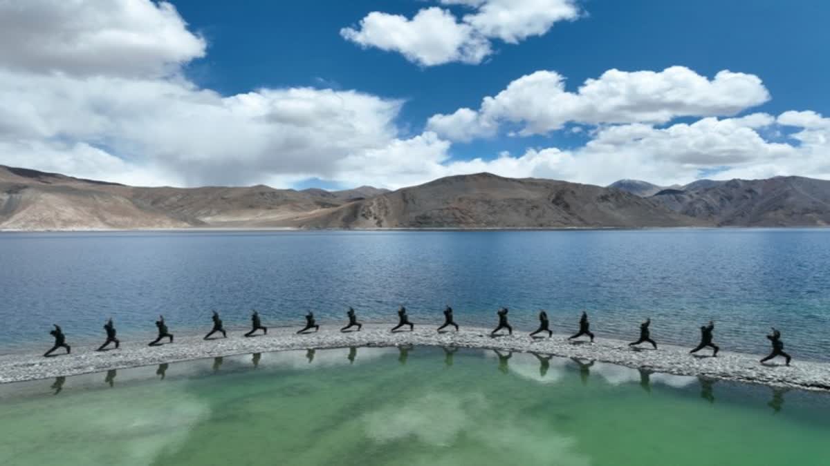 Indian Army personnel perform Yoga at Ladakh's Pangong Tso Lake