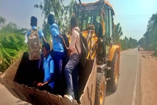 Students climb JCB to go to school