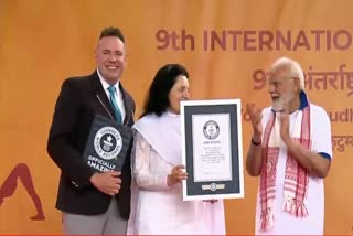 international-yoga-day-2023-yoga-event-led-by-pm-modi-enters-guinness-book