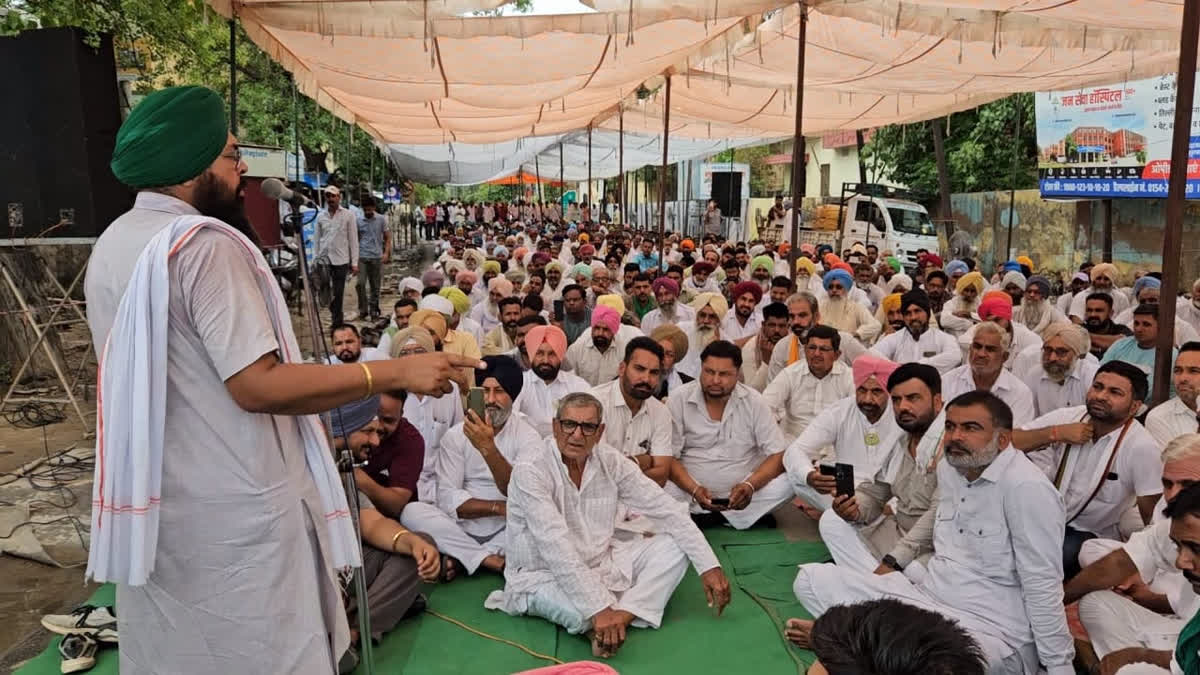 Farmers sit in at the Collectorate