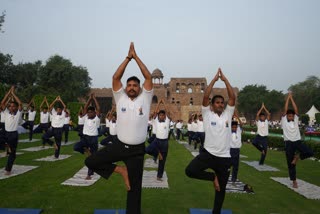 People take part in a yoga session at the Purana Qila complex on the International Day of Yoga, in New Delhi, Saturday, June 21, 2025.