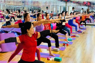 Women perform yoga in Vietnam