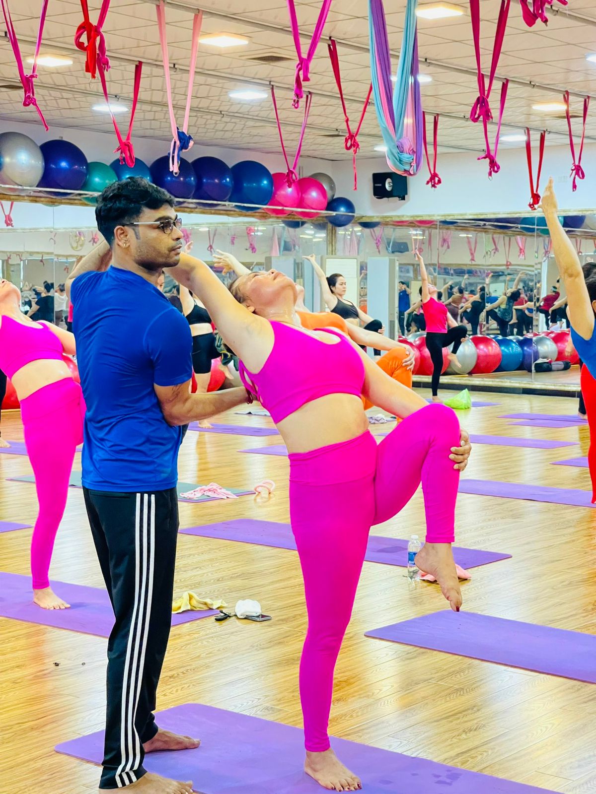 A youth from Karnataka teaches yoga to women in Vietnam