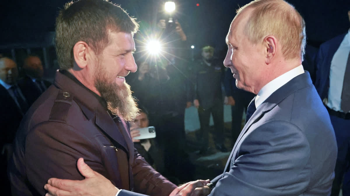 Russian President Vladimir Putin, right, is welcomed by Head of Russian Chechen Republic Ramzan Kadyrov upon his arrival at the city's airport in Grozny, Chechen Republic, Russia, Tuesday, Aug. 20, 2024.