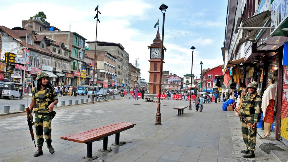 Paramilitary troopers on duty in Srinagar's Lal Chowk area with the famed clocktower in the background.