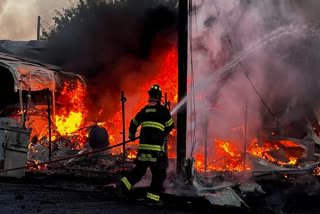 This image provided by Mark Matta shows a firefighter working on the scene of a plane crash in Odessa, Texas, Tuesday, Aug. 20, 2024.