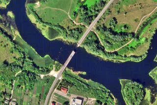 This satellite photo from Planet Labs PBC shows a destroyed bridge across the Seim River at the town of Glushkovo in Russia's Kursk region on Aug. 17, 2024.