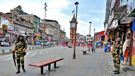 Paramilitary troopers on duty in Srinagar's Lal Chowk area with the famed clocktower in the background.