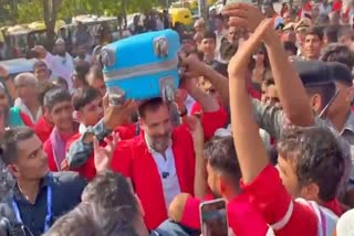 Rahul Gandhi interacts with porters at Anand Vihar railway station