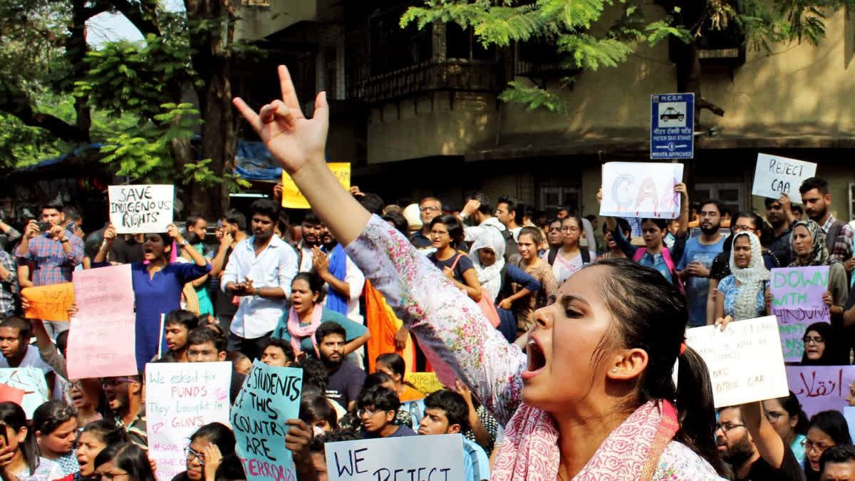 At TISS, students protested the suspension of Dalit PhD scholar Ramadas Prini Sivanandan during a convocation ceremony, expressing solidarity with staff facing job insecurity. Despite claims of a peaceful demonstration, police were called, and one student was forcibly removed. The suspension of Sivanandan, linked to his activism, has raised concerns about free speech on campus.