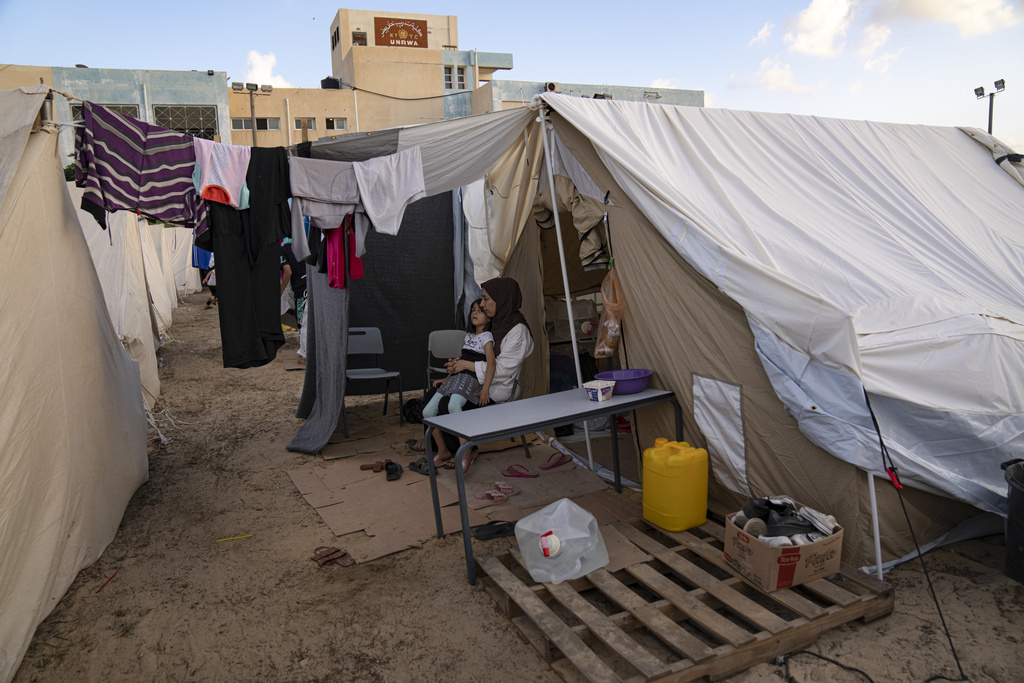A tent camp for displaced Palestinians pops up in southern Gaza, reawakening old traumas (AP photo)