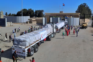 The border crossing between Egypt and Gaza opened on Saturday to let a trickle of desperately needed aid into the besieged Palestinian territory for the first time since Israel sealed it off in the wake of Hamas' bloody rampage two weeks ago.