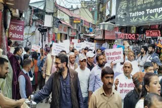 People take out a peace march over the Sanjauli mosque row, at Sunni in Shimla