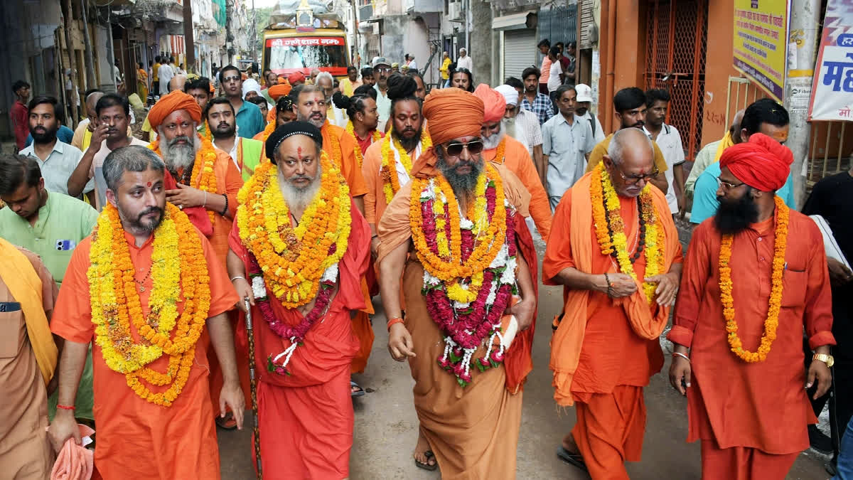 A group of saints led by the Panch Parmeshwara under the Panchayati Akhara Bada Udasin arrive for the Maha Kumbh Mela 2025, in Prayagraj on Friday.