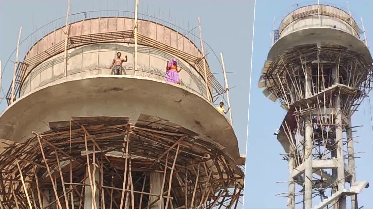 The family atop the water tank in Dausa