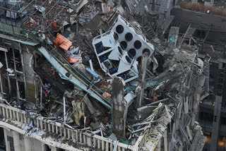 In this photo provided by the Ukrainian Emergency Service, firefighters work on the site of a damaged building after a Russian missile attack in Kyiv, Ukraine, Friday, Dec. 20, 2024.