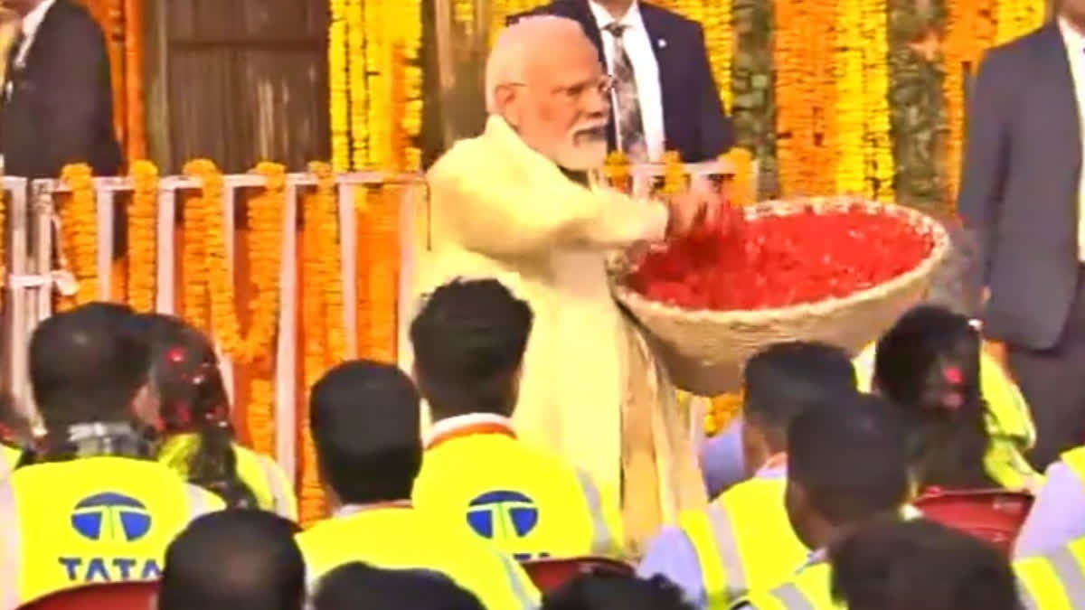 Prime Minister Narendra Modi Monday showered flower petals on the workers who were a part of the construction crew at Ram Temple in Ayodhya, Uttar Pradesh.