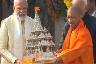 UP CM Yogi Adityanath gifts silver replica of Ram Mandir to PM Modi(Source: Screen grab of video shared by X@myogiadityanath)