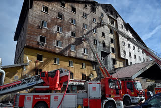 Firefighters work after a fire broke out at a hotel in the ski resort of Kartalkaya, located in the Bolu province, northwest Turkey, Tuesday, Jan. 21, 2025.