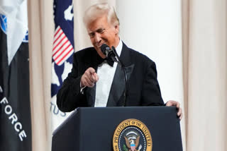 President Donald Trump speaks on stage at the Commander in Chief Ball