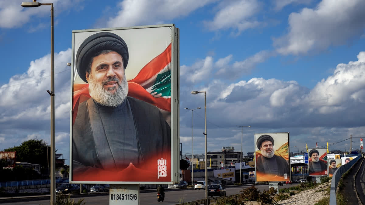 People drive past billboards with a picture of the late Lebanon's Hezbollah leader Sayyed Hashem Safieddine displayed on Beirut airport highway, Lebanon, Friday, Feb. 21, 2025.